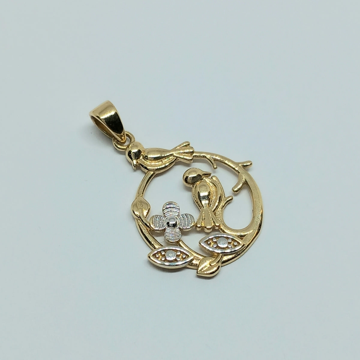 Přívěšek ze žlutého a bílého zlata 14k . Ptáček . 1,50g . stav A1