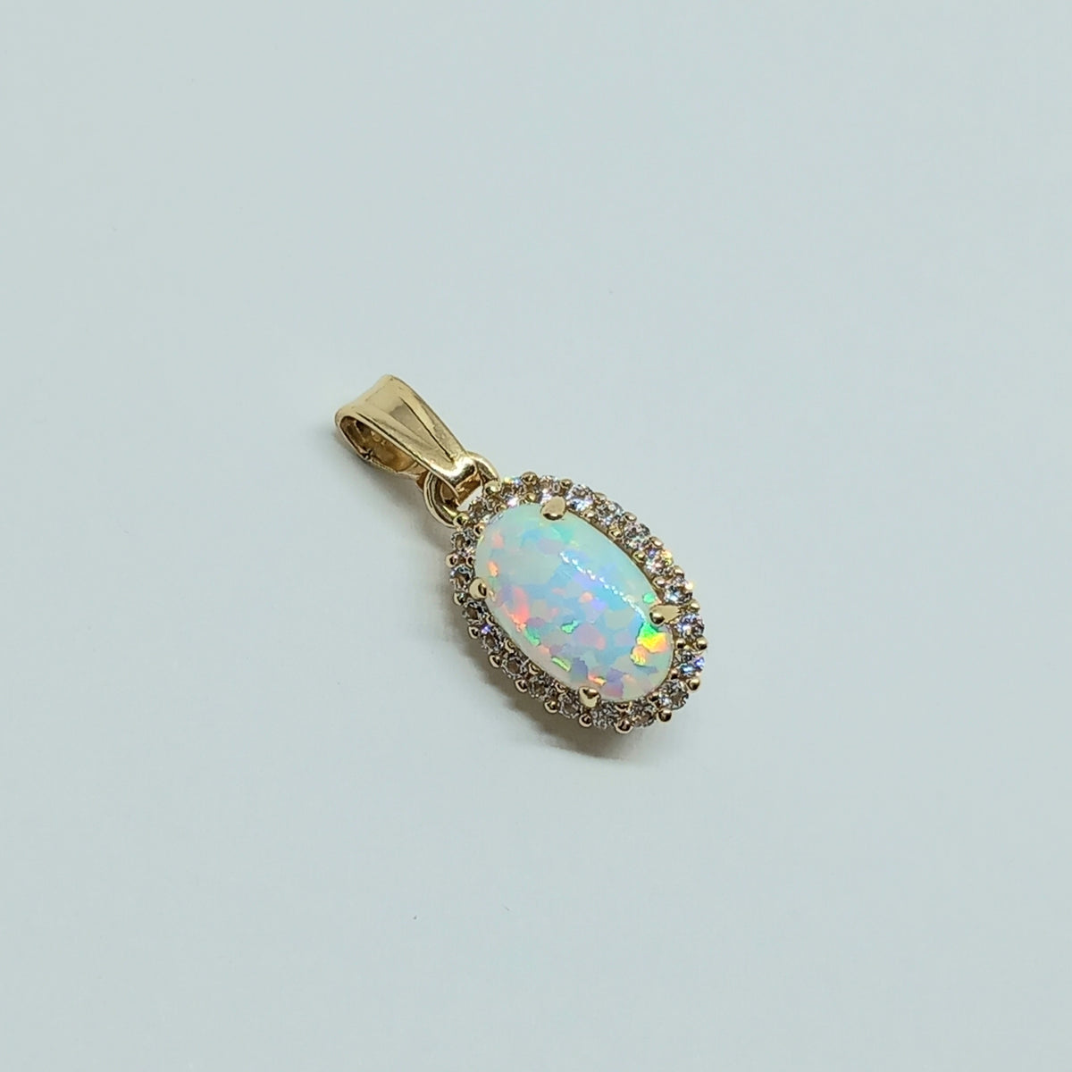 Přívěšek ze žlutého zlata 14k . Opál . 1,49g . stav A